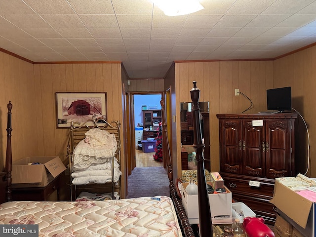 bedroom with wood walls