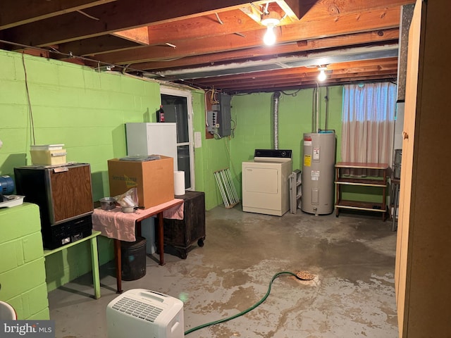 basement featuring electric panel, water heater, and washer and dryer