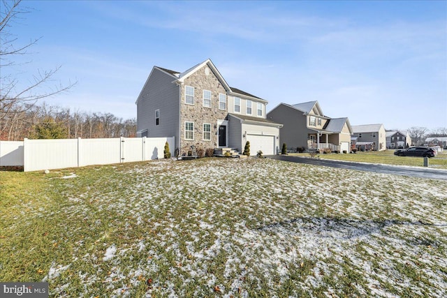 rear view of house with a garage