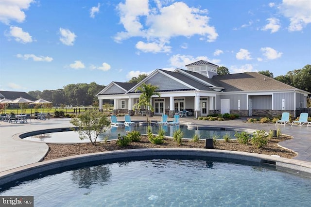 view of swimming pool with a patio area