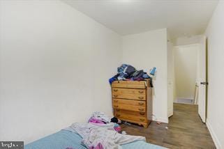 bedroom with hardwood / wood-style flooring