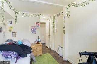 bedroom featuring dark hardwood / wood-style flooring