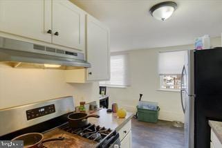 kitchen featuring white cabinetry and appliances with stainless steel finishes