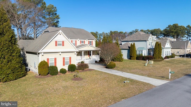 view of front of property featuring covered porch, a front yard, and central AC unit