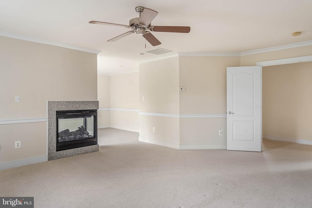 unfurnished living room featuring light carpet, crown molding, a multi sided fireplace, and ceiling fan