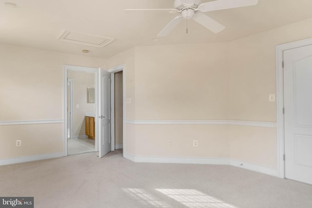 unfurnished room with ceiling fan and light carpet