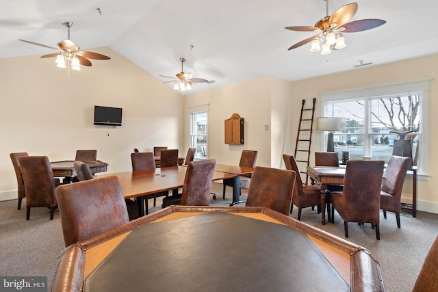 dining space featuring carpet floors, lofted ceiling, and ceiling fan