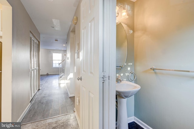 bathroom with hardwood / wood-style flooring