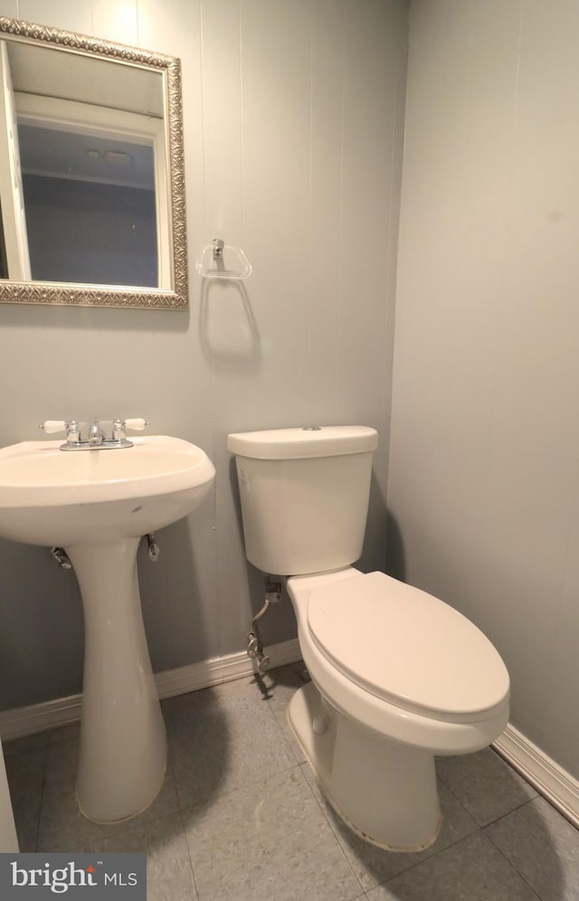 bathroom with tile patterned floors and toilet