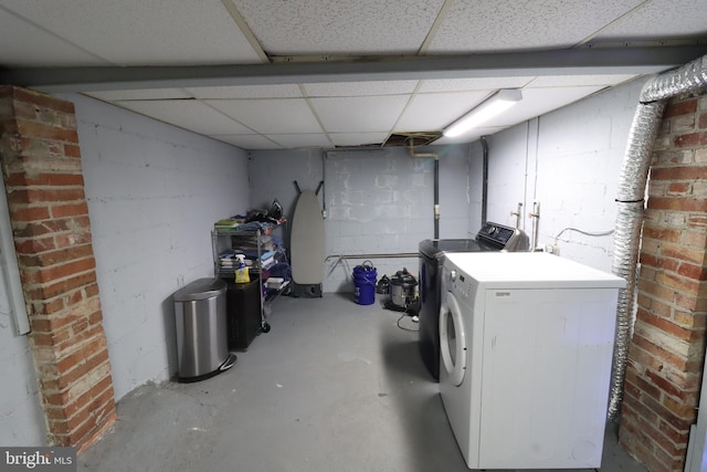 washroom featuring washing machine and dryer