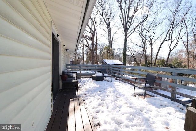 view of snow covered deck