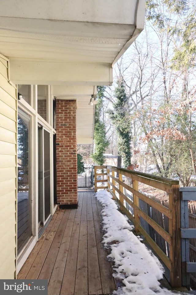 view of snow covered deck