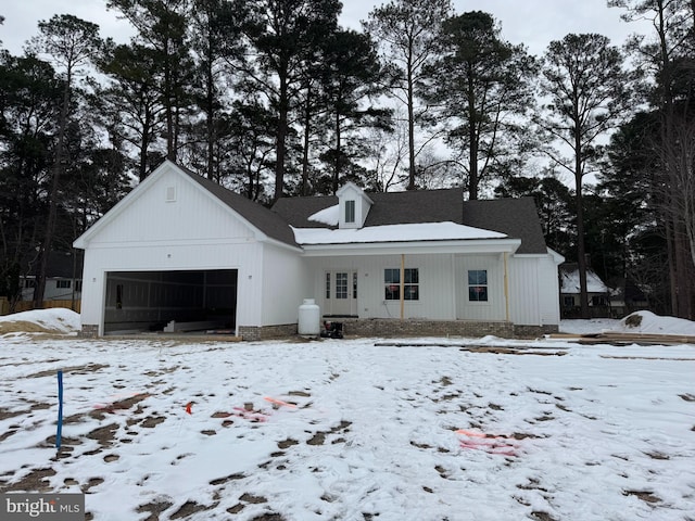 view of front of home featuring a garage and covered porch