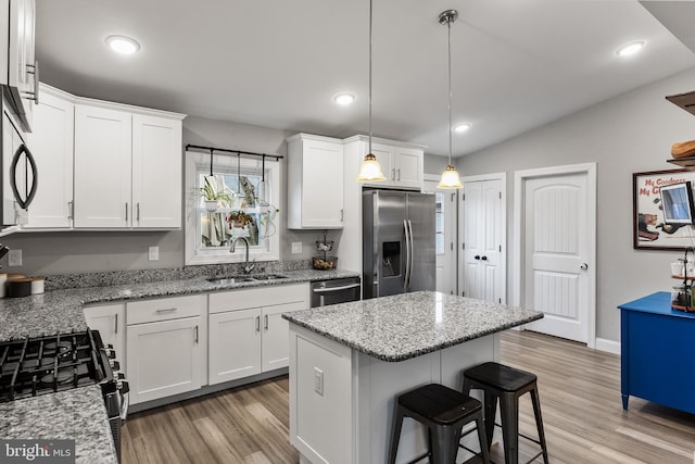 kitchen featuring white cabinetry, stainless steel appliances, and sink