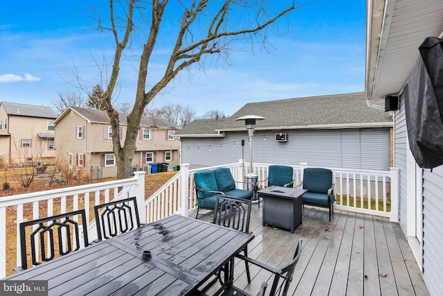 deck featuring an outdoor fire pit