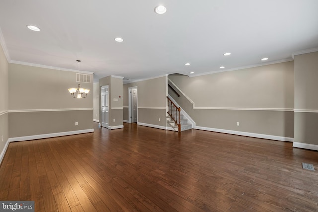 unfurnished living room with dark hardwood / wood-style flooring, crown molding, and a chandelier