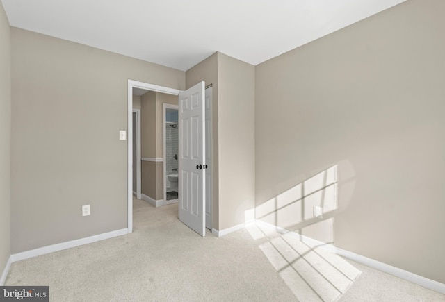 spare room with light colored carpet