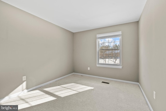 empty room featuring light colored carpet