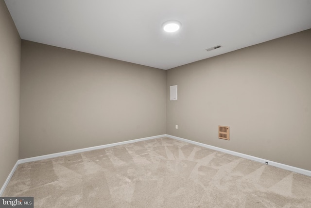 spare room with light colored carpet