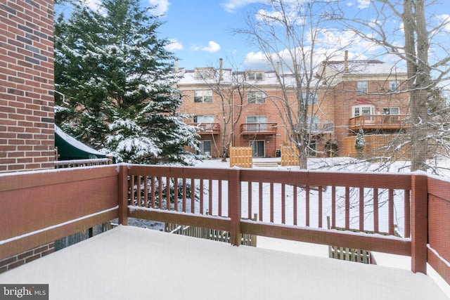 view of snow covered deck