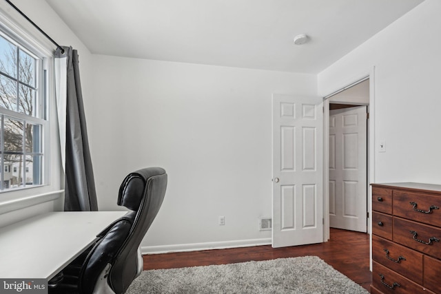 office space featuring dark hardwood / wood-style flooring