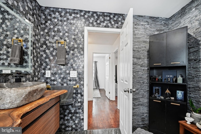 bathroom with vanity and hardwood / wood-style floors