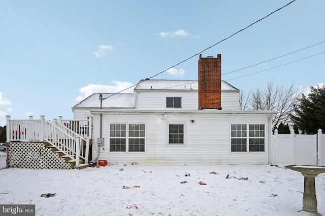 view of snow covered house