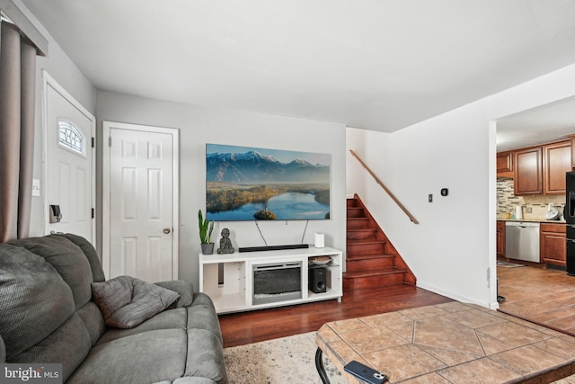 living room with a fireplace and hardwood / wood-style floors