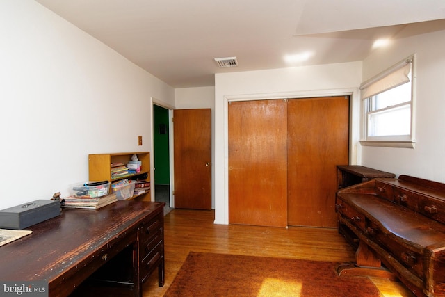 home office with wood-type flooring