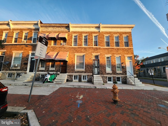 view of front of property with cooling unit