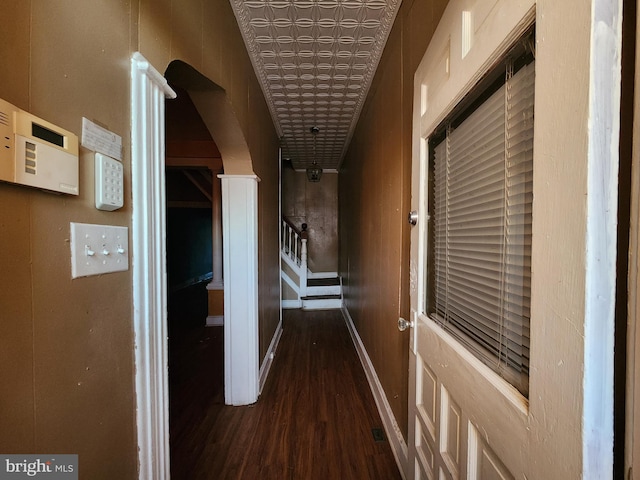 hallway with dark hardwood / wood-style floors