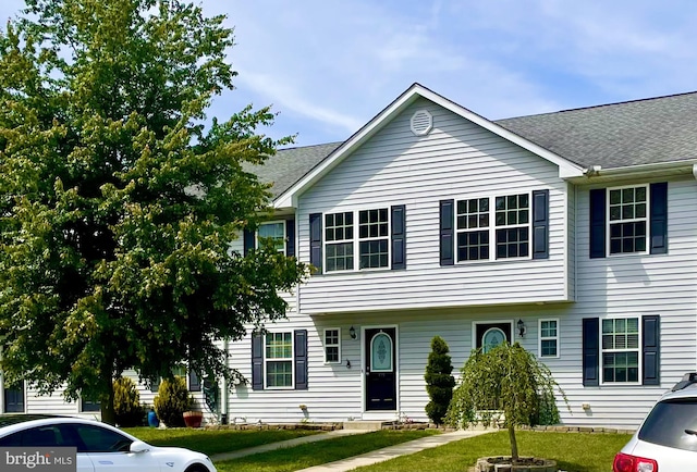 view of front of home with a front yard