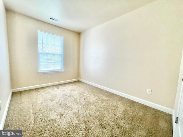 view of carpeted spare room