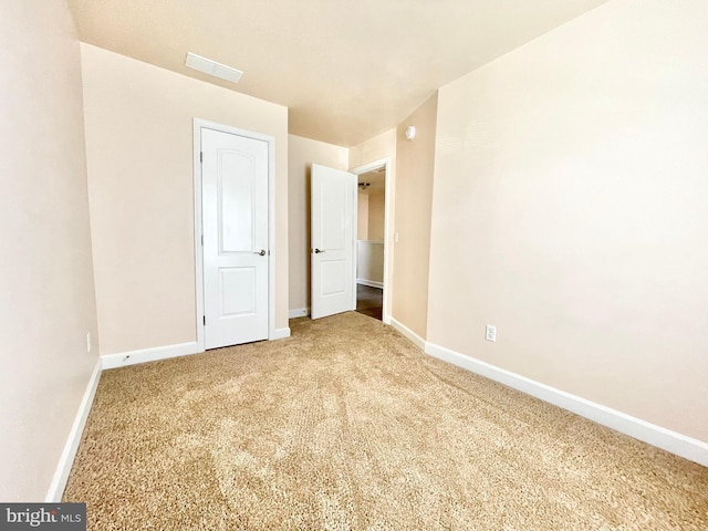 unfurnished bedroom featuring carpet