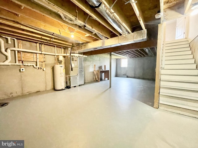 basement featuring heating unit and water heater