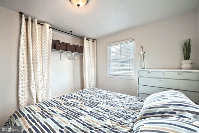 bedroom with a closet and a textured ceiling