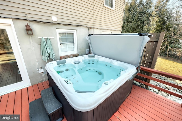 wooden terrace with a hot tub