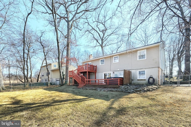 back of property featuring stairs, a yard, a wooden deck, fence private yard, and a chimney