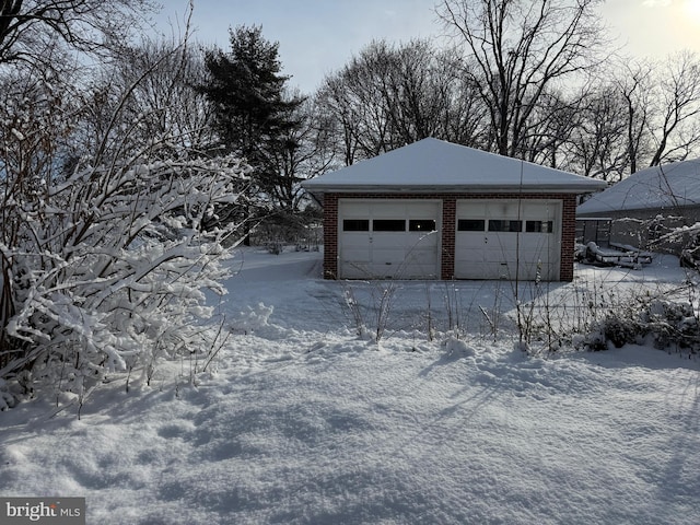 view of snow covered garage