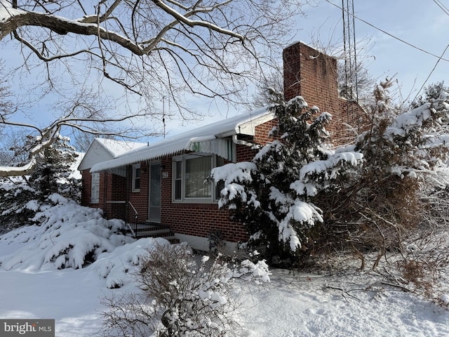 view of snow covered property