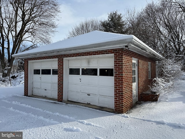 view of snow covered garage