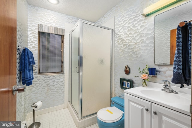 bathroom featuring a shower with door, tile patterned flooring, vanity, a textured ceiling, and toilet