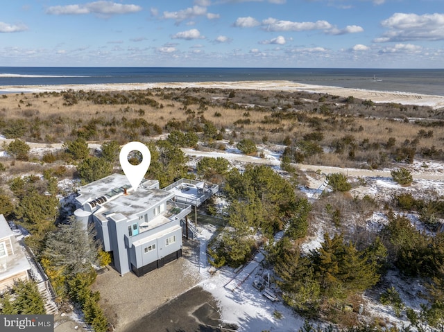 aerial view with a water view and a view of the beach