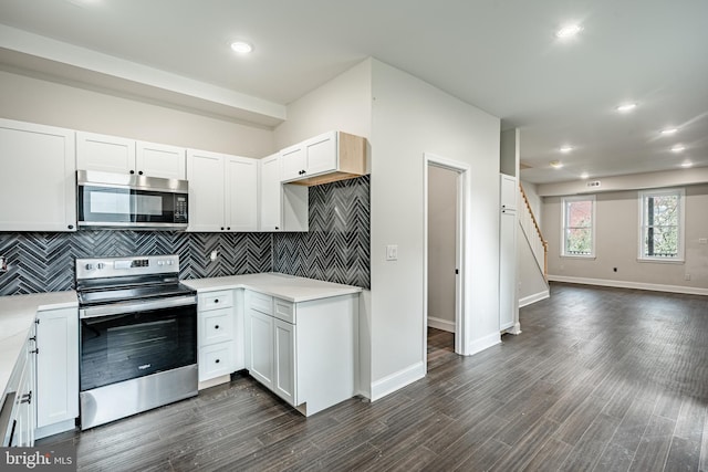 kitchen with white cabinetry and appliances with stainless steel finishes