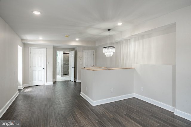 spare room featuring a chandelier