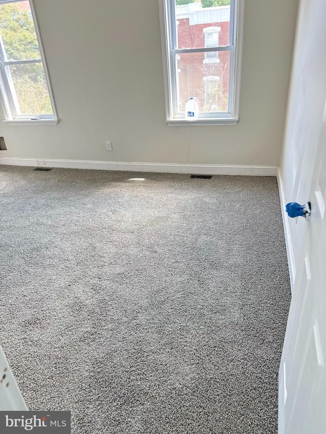 spare room featuring plenty of natural light