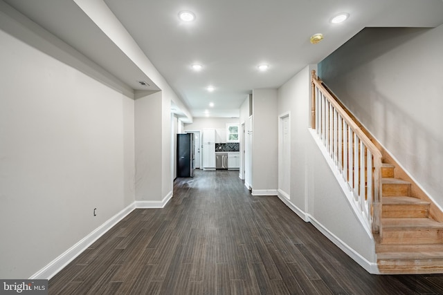 hallway featuring dark hardwood / wood-style flooring