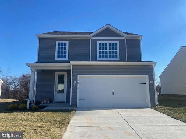 front of property featuring a garage and a front yard