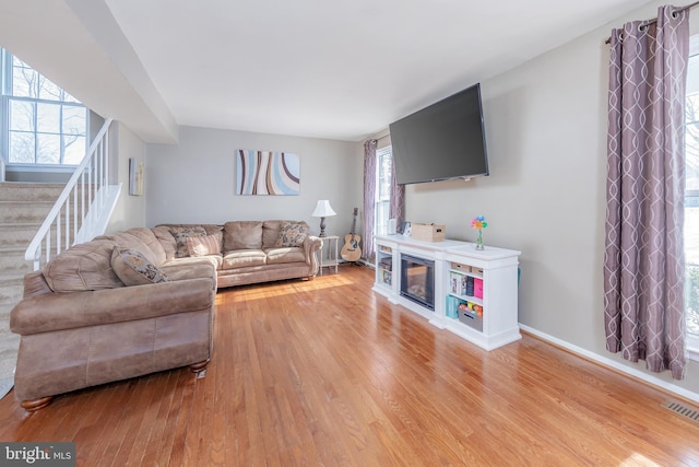 living room with light hardwood / wood-style floors