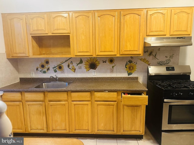 kitchen with decorative backsplash, sink, light tile patterned floors, and stainless steel gas range